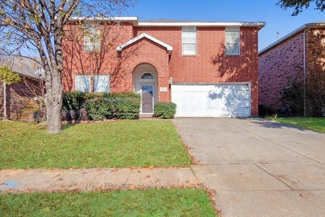 view of front of property with a garage and a front yard