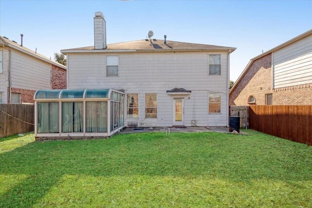 back of house featuring a yard, central AC unit, and a sunroom