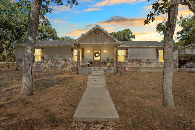 view of front of property with a carport and covered porch