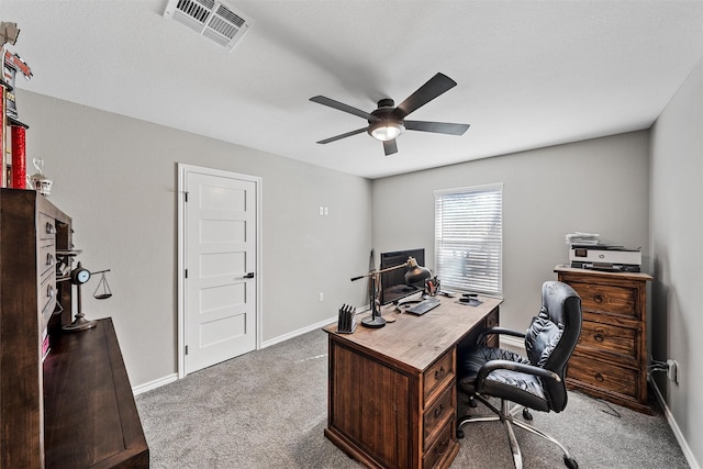 home office featuring ceiling fan and carpet floors