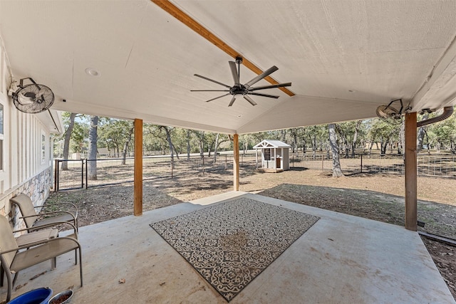 view of patio featuring ceiling fan and a storage shed