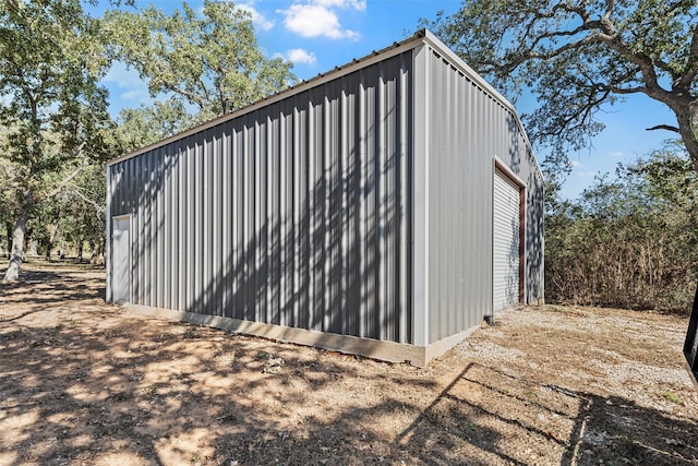 view of outbuilding featuring a garage