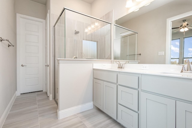 bathroom featuring tile patterned floors, ceiling fan, vanity, and an enclosed shower