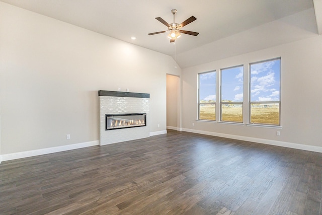 unfurnished living room with ceiling fan, lofted ceiling, and dark hardwood / wood-style floors