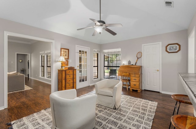 living room featuring ceiling fan, dark hardwood / wood-style flooring, and crown molding