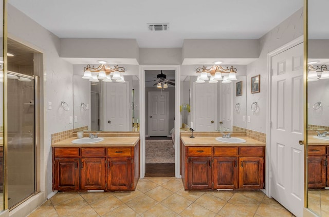 bathroom featuring ceiling fan, walk in shower, and vanity