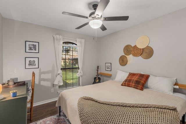 bedroom featuring ceiling fan and dark hardwood / wood-style flooring