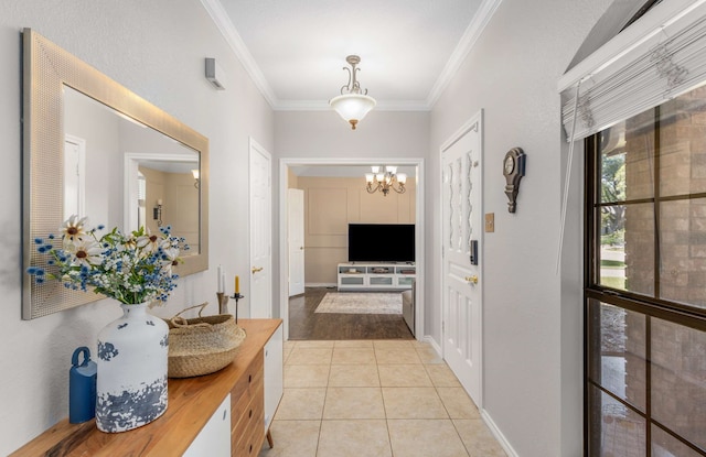 corridor featuring a notable chandelier, light tile patterned flooring, and crown molding