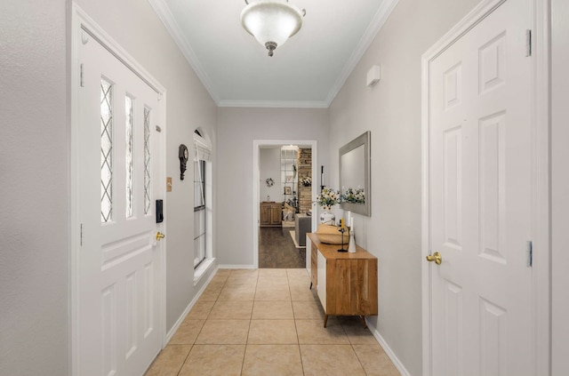 entrance foyer with light tile patterned floors and crown molding