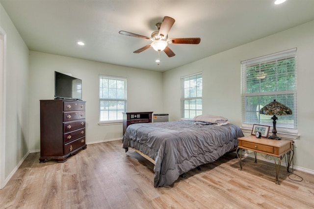 bedroom featuring light hardwood / wood-style flooring and ceiling fan