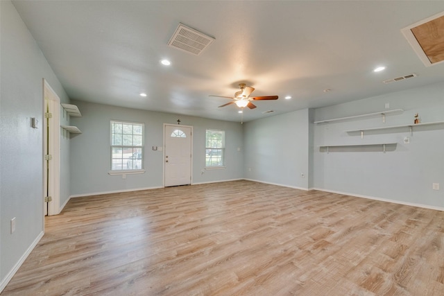 unfurnished living room with light hardwood / wood-style flooring and ceiling fan