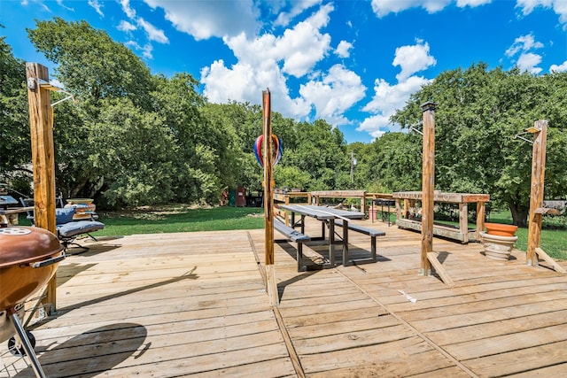 wooden deck featuring area for grilling