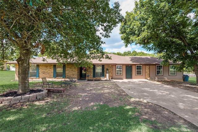 ranch-style home with a front lawn