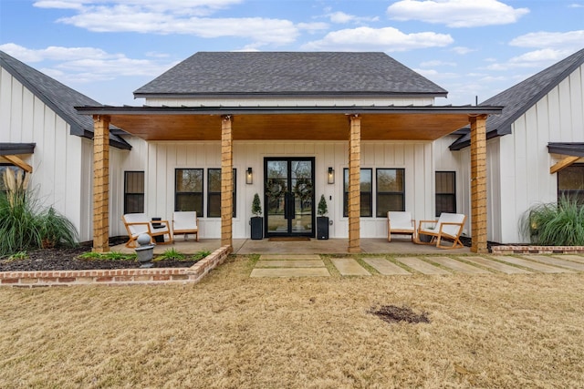 rear view of property featuring a patio area and french doors