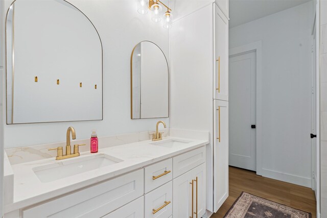 bathroom featuring hardwood / wood-style floors and vanity