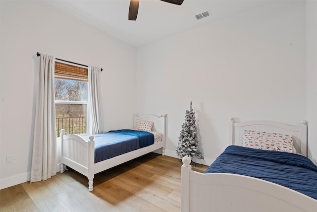 bedroom with hardwood / wood-style flooring and ceiling fan