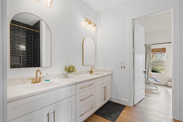 bathroom with hardwood / wood-style flooring and vanity