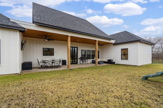 back of house with outdoor lounge area, a yard, a patio, and ceiling fan