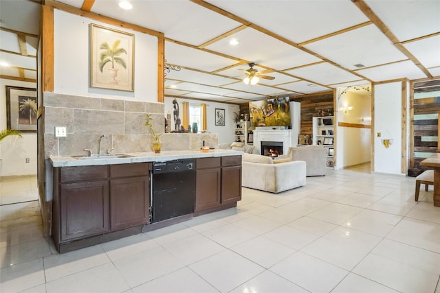 kitchen featuring dishwasher, dark brown cabinetry, ceiling fan, and sink