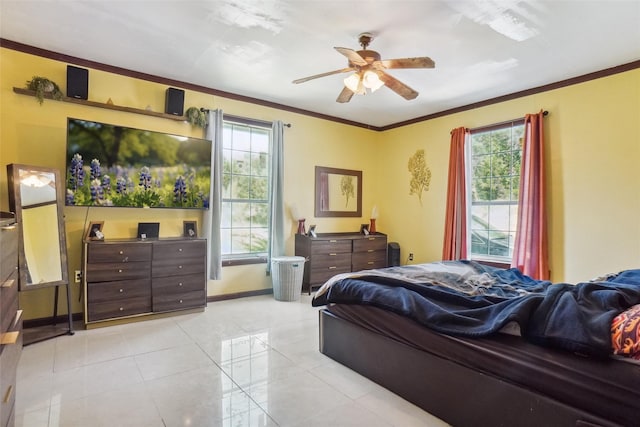 bedroom featuring multiple windows, ceiling fan, and ornamental molding