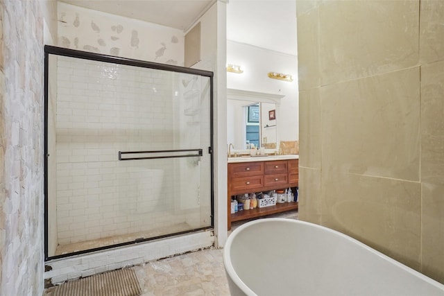 bathroom featuring separate shower and tub and vanity