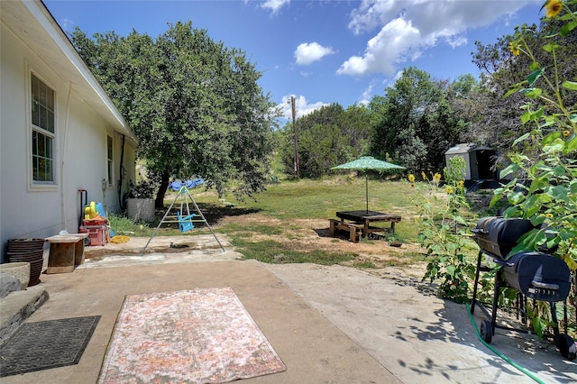 view of patio / terrace featuring a storage shed