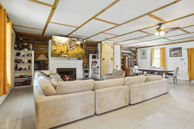 living room with wooden walls and ceiling fan