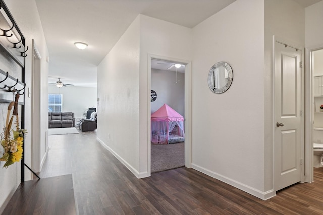 corridor featuring dark hardwood / wood-style flooring