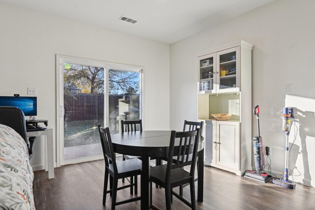 dining space featuring dark hardwood / wood-style floors