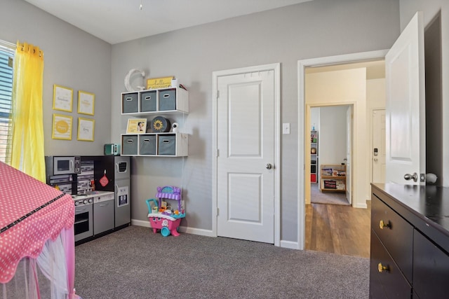 bedroom with dark colored carpet