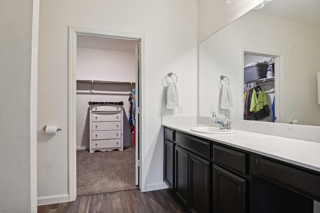 bathroom with vanity and wood-type flooring