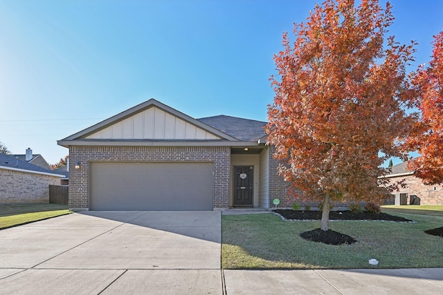 view of front facade with a garage and a front lawn