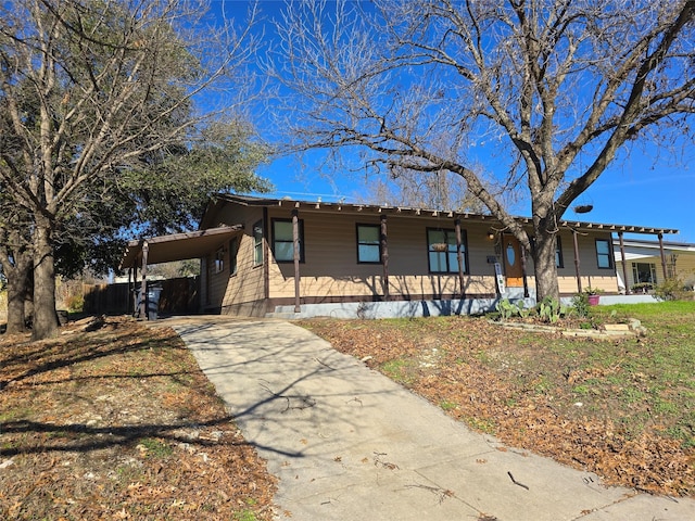 view of front of home featuring a carport and covered porch