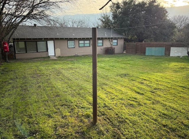 view of yard with central air condition unit