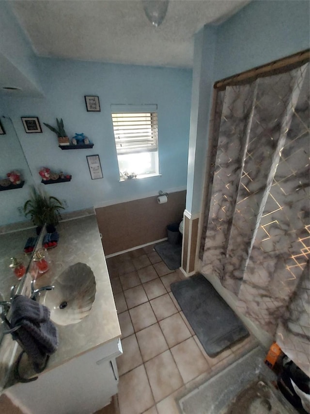 bathroom with tile patterned floors, vanity, and a shower with shower curtain