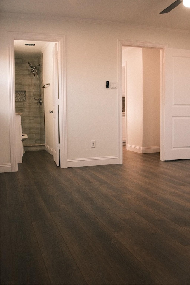 interior space with ceiling fan and dark hardwood / wood-style floors