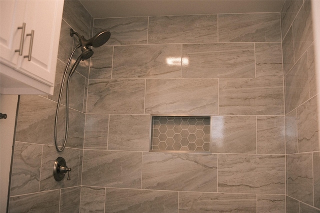 bathroom with tiled shower