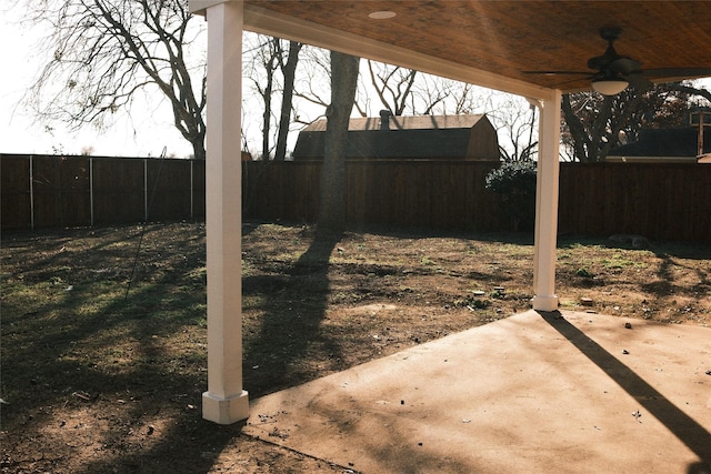 view of yard featuring ceiling fan and a patio area