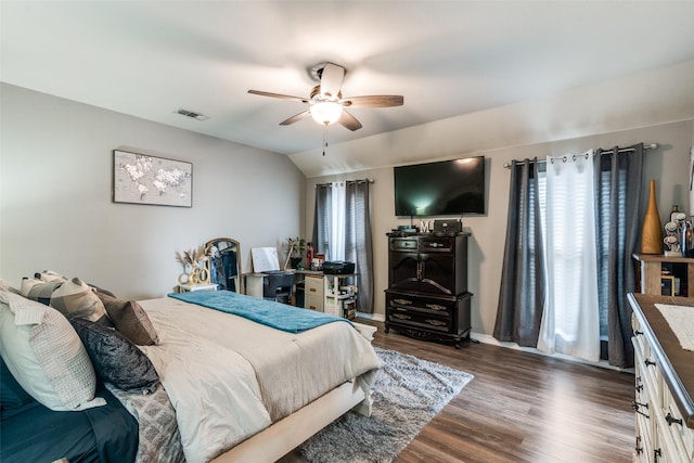 bedroom with vaulted ceiling, dark hardwood / wood-style floors, and ceiling fan