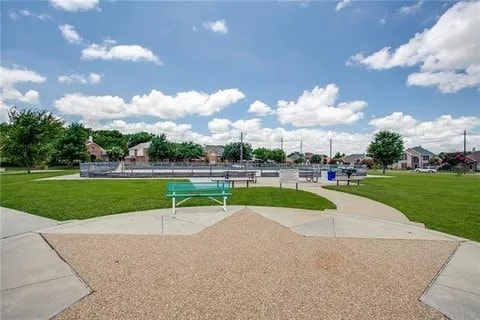 view of home's community with a lawn