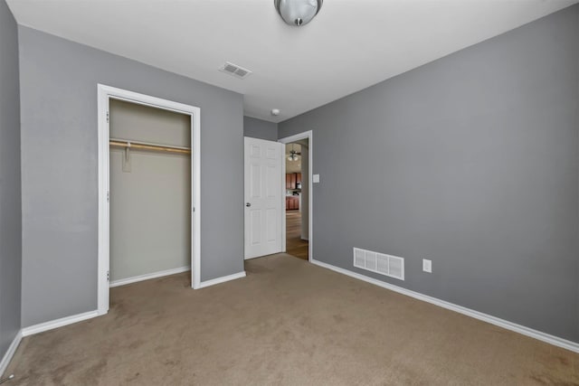 unfurnished bedroom featuring a closet and carpet