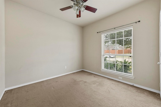 unfurnished room featuring light carpet and ceiling fan