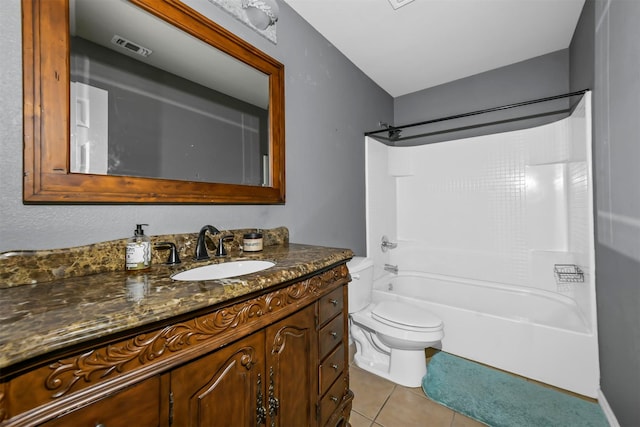 full bathroom featuring shower / washtub combination, vanity, tile patterned floors, and toilet