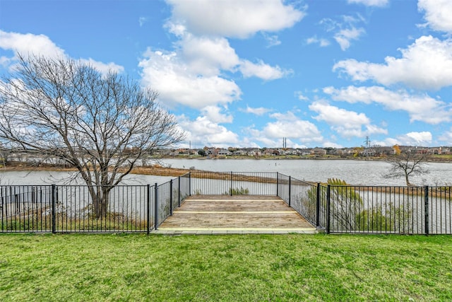 dock area featuring a water view and a lawn