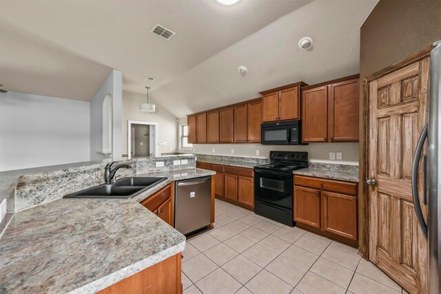 kitchen featuring vaulted ceiling, pendant lighting, sink, light tile patterned floors, and black appliances