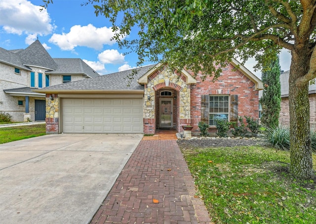 view of front of property with a garage