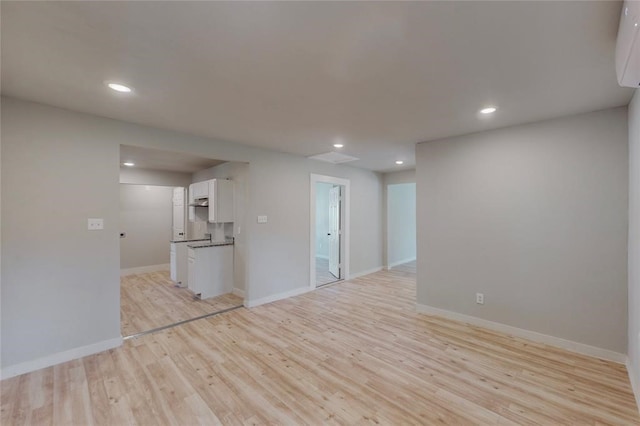 unfurnished living room with light hardwood / wood-style flooring