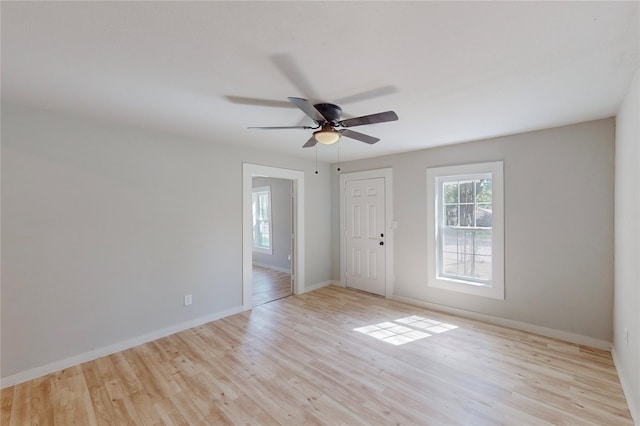 spare room featuring light hardwood / wood-style floors and ceiling fan