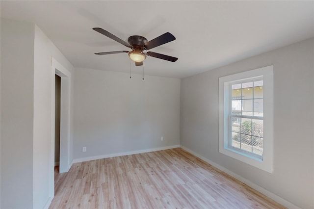 empty room featuring light hardwood / wood-style flooring and ceiling fan