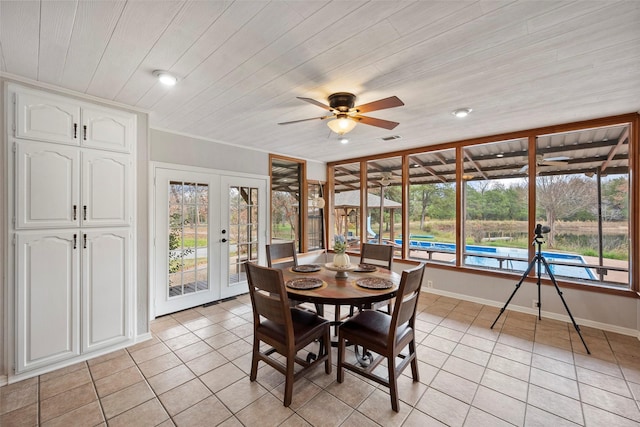 tiled dining area featuring wooden ceiling, ceiling fan, and french doors